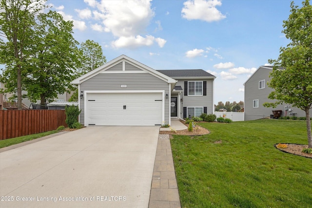1123 Chesham Ln, Grand Ledge, MI 48837 - view of front facade featuring driveway and a garage