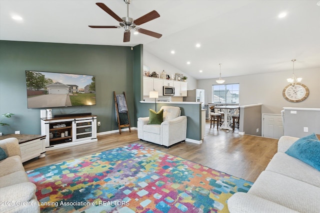 1123 Chesham Ln, Grand Ledge, MI 48837 - living area featuring ceiling fan, wood finished floors, lofted ceiling, recessed lighting, and baseboards