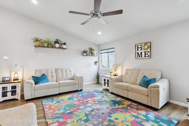 1123 Chesham Ln, Grand Ledge, MI 48837 - living area featuring wood finished floors, a ceiling fan, recessed lighting, baseboards, and lofted ceiling