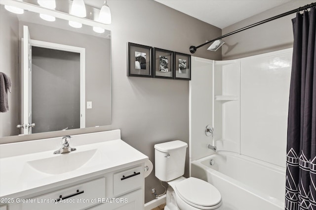 1123 Chesham Ln, Grand Ledge, MI 48837 - bathroom featuring shower / bath combination with curtain, toilet, and vanity