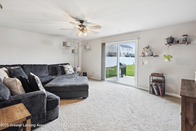 1123 Chesham Ln, Grand Ledge, MI 48837 - living room with carpet floors, a ceiling fan, and baseboards