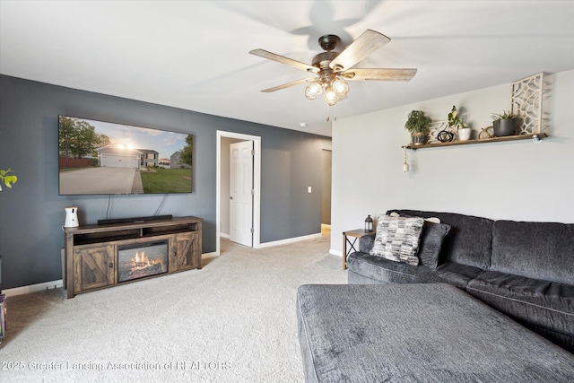 1123 Chesham Ln, Grand Ledge, MI 48837 - living area featuring carpet flooring, a ceiling fan, and baseboards