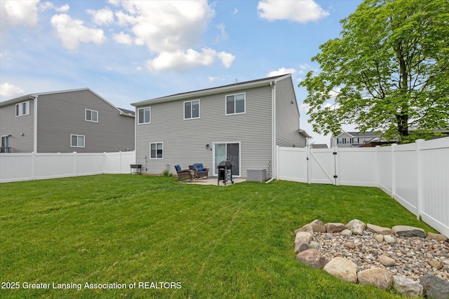 1123 Chesham Ln, Grand Ledge, MI 48837 - back of house featuring a gate, a patio, and cooling unit