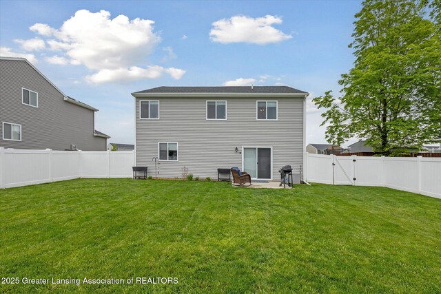 1123 Chesham Ln, Grand Ledge, MI 48837 - rear view of property with a patio and a gate