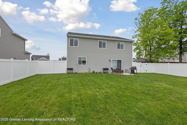 1123 Chesham Ln, Grand Ledge, MI 48837 - rear view of property with a patio area and central AC unit