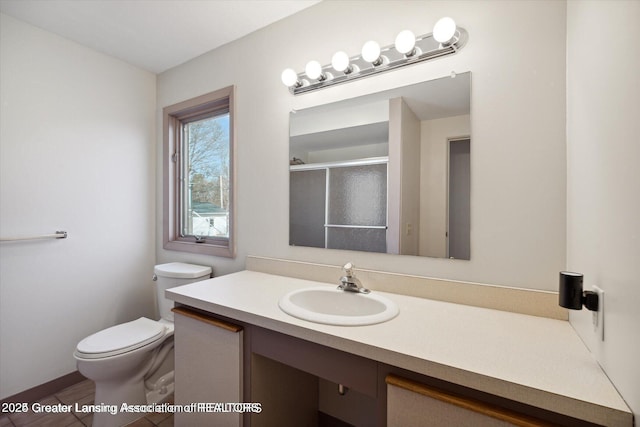 4794 Ardmore Ave, Okemos, MI 48864 - full bath with toilet, vanity, and a stall shower