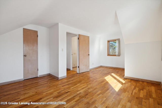 4794 Ardmore Ave, Okemos, MI 48864 - bonus room with lofted ceiling, light wood-style floors, and baseboards
