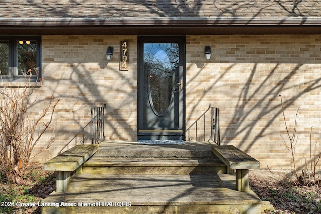 4794 Ardmore Ave, Okemos, MI 48864 - view of exterior entry featuring roof with shingles