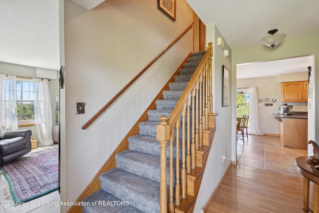 12898 Walker Rd, Leslie, MI 49251 - stairway with wood finished floors and baseboards
