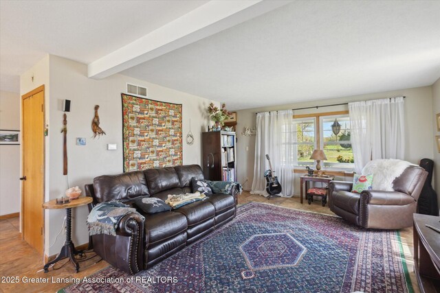 12898 Walker Rd, Leslie, MI 49251 - living area with beam ceiling