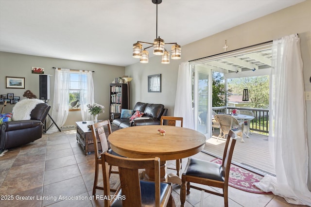 12898 Walker Rd, Leslie, MI 49251 - tiled dining area featuring a chandelier