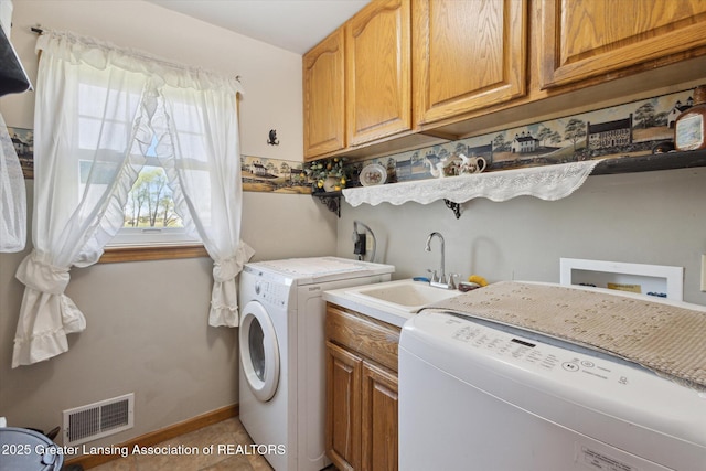 12898 Walker Rd, Leslie, MI 49251 - washroom with washer and dryer, cabinet space, and baseboards