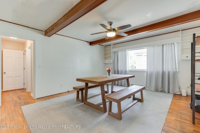 635 Division St, East Lansing, MI 48823 - dining space with light wood finished floors, beamed ceiling, and ceiling fan