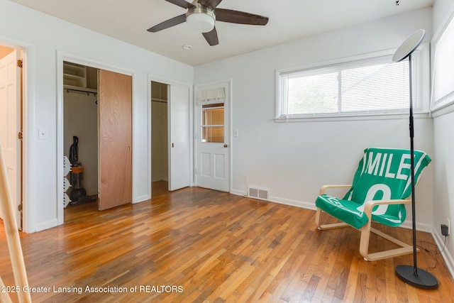 635 Division St, East Lansing, MI 48823 - unfurnished room with light wood-style flooring, ceiling fan, and baseboards