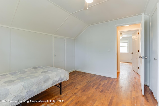 635 Division St, East Lansing, MI 48823 - bedroom featuring vaulted ceiling and wood finished floors