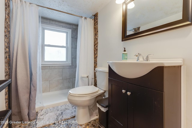 635 Division St, East Lansing, MI 48823 - bathroom with toilet, a stall shower, and vanity