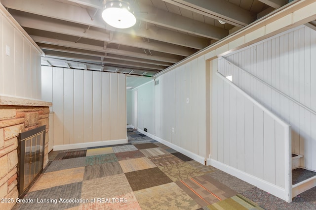 635 Division St, East Lansing, MI 48823 - below grade area featuring a fireplace with flush hearth and baseboards