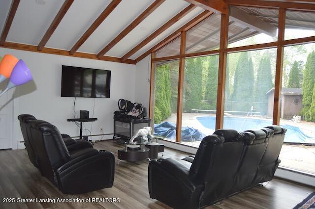 6157 W Stoll Rd, Lansing, MI 48906 - living area with wood finished floors, baseboard heating, and floor to ceiling windows