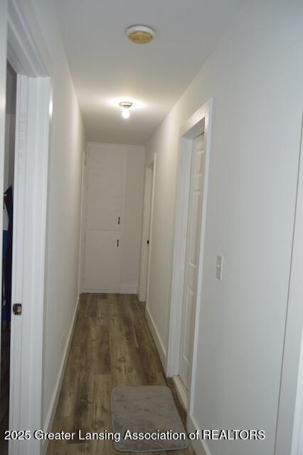 6157 W Stoll Rd, Lansing, MI 48906 - hall with wood finished floors and baseboards