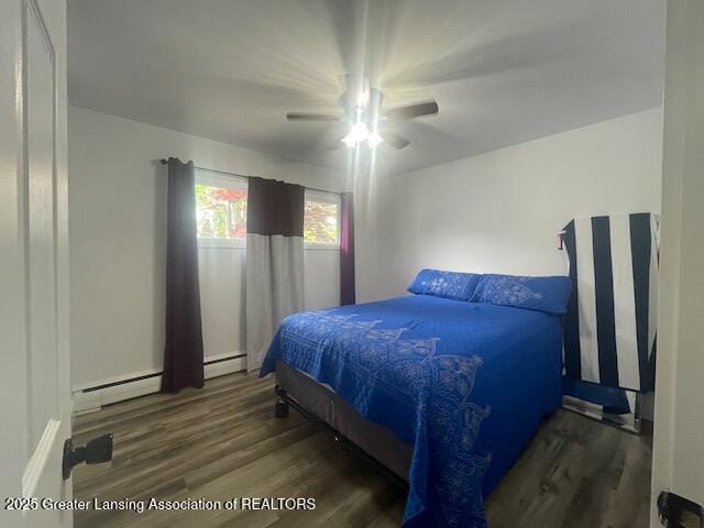 6157 W Stoll Rd, Lansing, MI 48906 - bedroom featuring wood finished floors, a baseboard radiator, and a ceiling fan