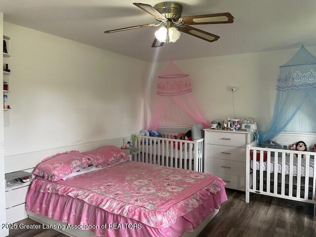 6157 W Stoll Rd, Lansing, MI 48906 - bedroom featuring wood finished floors and a ceiling fan