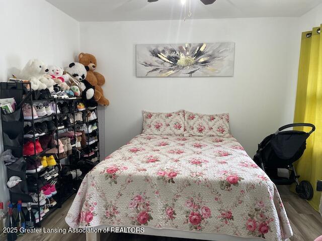 6157 W Stoll Rd, Lansing, MI 48906 - bedroom featuring wood finished floors and ceiling fan
