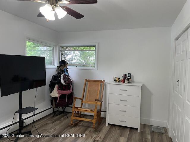 6157 W Stoll Rd, Lansing, MI 48906 - sitting room with ceiling fan and wood finished floors
