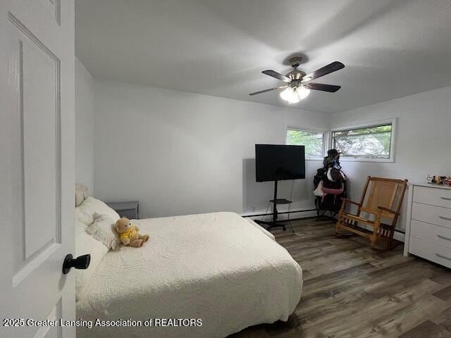 6157 W Stoll Rd, Lansing, MI 48906 - bedroom with wood finished floors and ceiling fan
