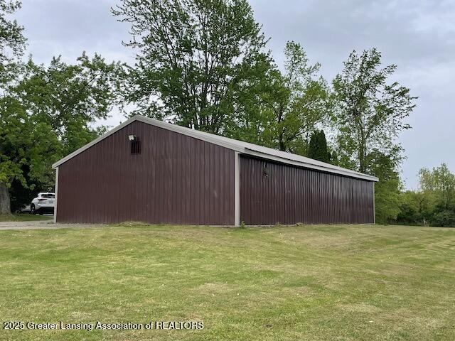 6157 W Stoll Rd, Lansing, MI 48906 - view of pole building with a lawn
