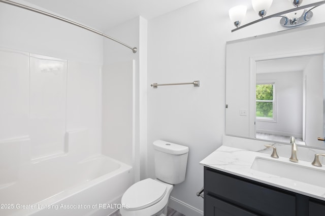 2107 Reo Rd, Lansing, MI 48910 - full bathroom with toilet, vanity, and shower / washtub combination