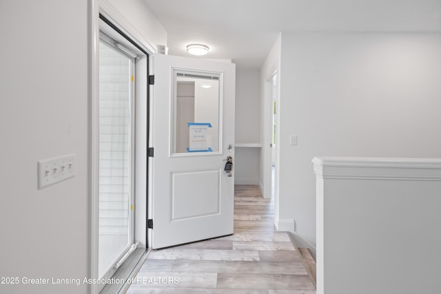 2107 Reo Rd, Lansing, MI 48910 - hall with light wood-type flooring and baseboards