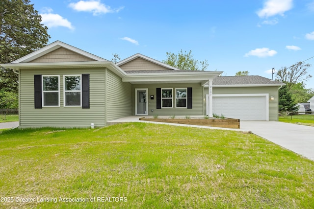 2107 Reo Rd, Lansing, MI 48910 - view of front of property with concrete driveway, a front yard, an attached garage, and covered porch