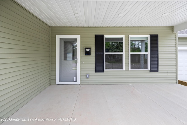 2107 Reo Rd, Lansing, MI 48910 - doorway to property with a patio area