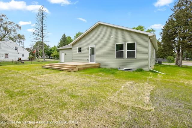 2107 Reo Rd, Lansing, MI 48910 - back of property featuring a wooden deck