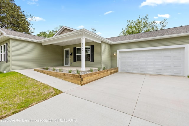 2107 Reo Rd, Lansing, MI 48910 - single story home featuring a porch, driveway, an attached garage, and roof with shingles