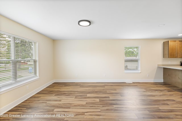 4205 Glenburne Blvd, Lansing, MI 48911 - unfurnished living room featuring light wood-type flooring, baseboards, and recessed lighting