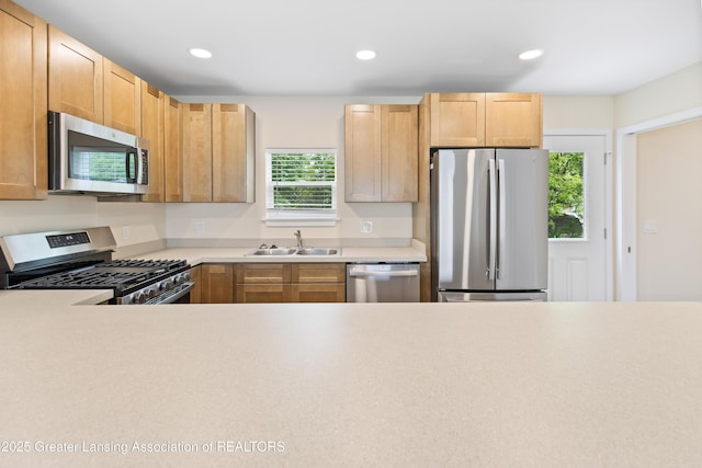 4205 Glenburne Blvd, Lansing, MI 48911 - kitchen featuring stainless steel appliances, a sink, light countertops, recessed lighting, and light brown cabinetry