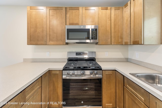 4205 Glenburne Blvd, Lansing, MI 48911 - kitchen with stainless steel appliances and light countertops