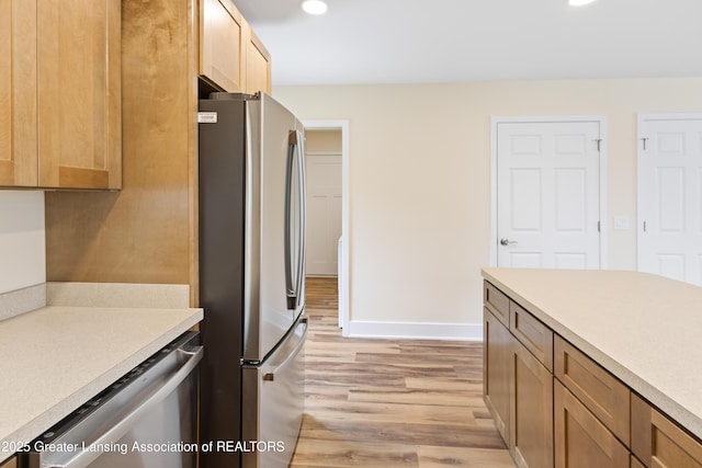 4205 Glenburne Blvd, Lansing, MI 48911 - kitchen featuring stainless steel appliances, light wood-type flooring, recessed lighting, light countertops, and baseboards