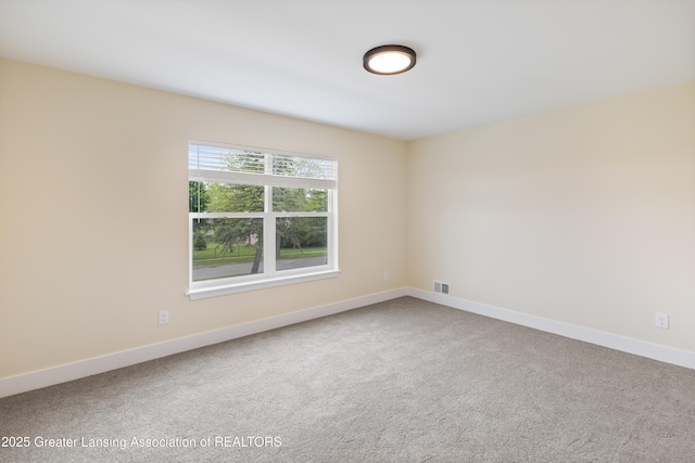 4205 Glenburne Blvd, Lansing, MI 48911 - carpeted spare room with baseboards