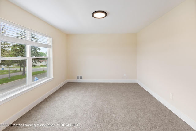 4205 Glenburne Blvd, Lansing, MI 48911 - spare room featuring carpet flooring and baseboards
