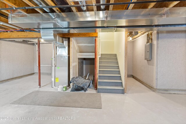 4205 Glenburne Blvd, Lansing, MI 48911 - unfinished basement with electric panel, stairs, and heating unit