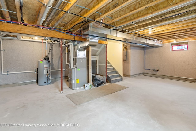 4205 Glenburne Blvd, Lansing, MI 48911 - basement featuring gas water heater, stairway, heating unit, and electric panel