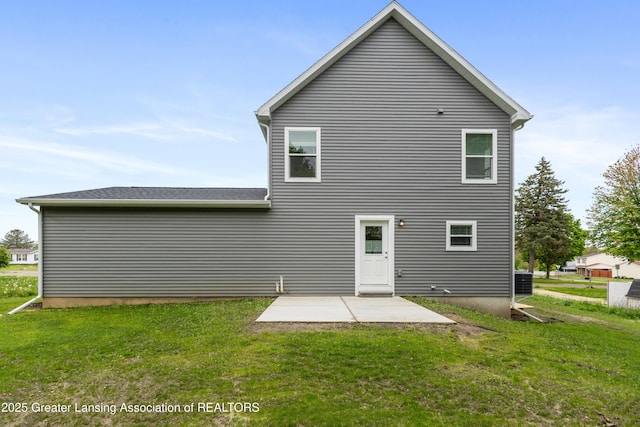 4205 Glenburne Blvd, Lansing, MI 48911 - rear view of property with a lawn and a patio