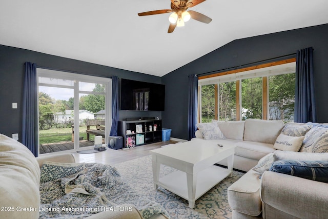 513 E Grand River Rd, Laingsburg, MI 48848 - living area with healthy amount of natural light, lofted ceiling, a ceiling fan, and wood finished floors