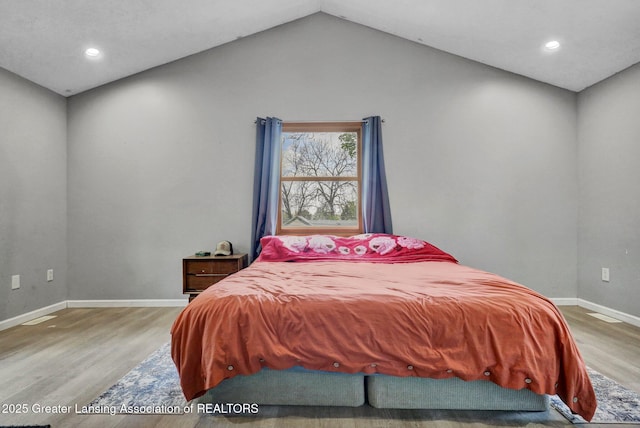 513 E Grand River Rd, Laingsburg, MI 48848 - bedroom with wood finished floors, baseboards, recessed lighting, and vaulted ceiling