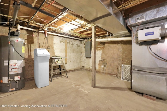 513 E Grand River Rd, Laingsburg, MI 48848 - unfinished basement featuring gas water heater, a water softener, and electric panel