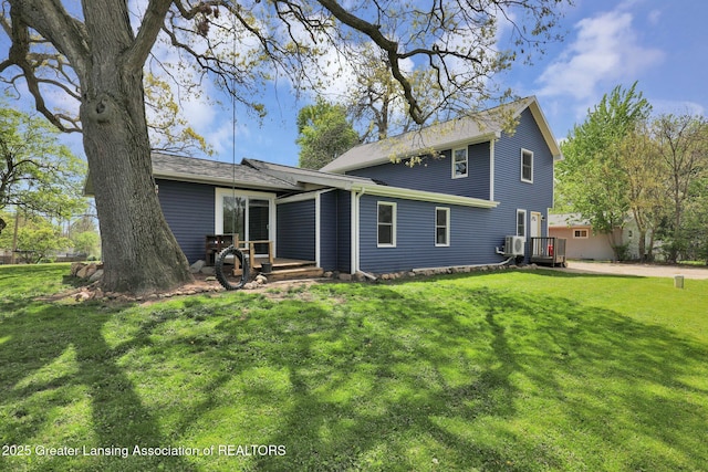 513 E Grand River Rd, Laingsburg, MI 48848 - back of house with a yard and a wooden deck