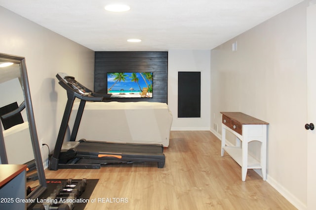 14275 Webster Rd, Bath, MI 48808 - workout area with wood finished floors, baseboards, and recessed lighting