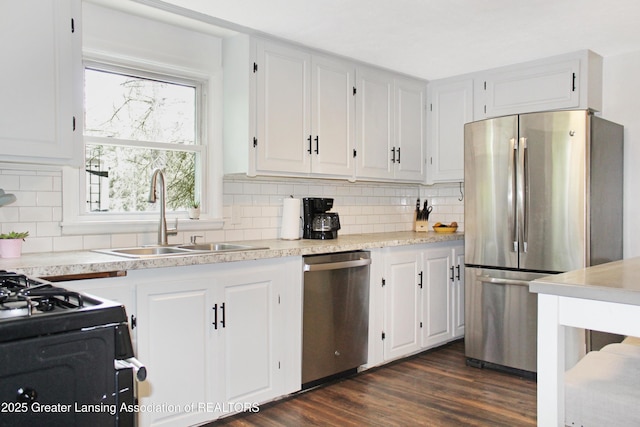 14275 Webster Rd, Bath, MI 48808 - kitchen featuring stainless steel appliances, a sink, and white cabinets